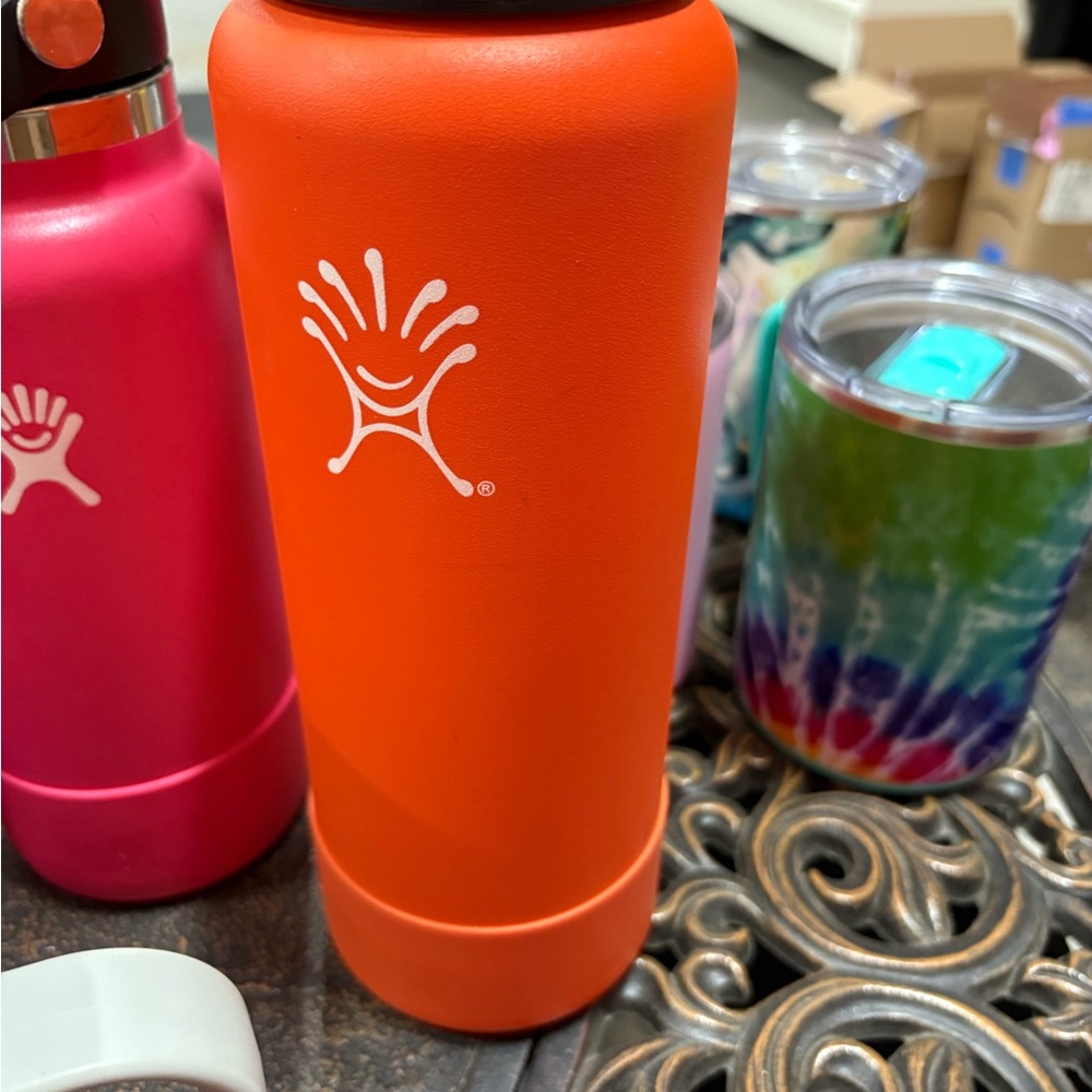 Hydroflask orange bottle/ thermos bottle. This has been used a couple times EUC.